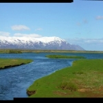 Panorama of and Icelandic river entering the sea.