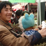 Tibetan man and child at market