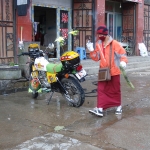 Monk washing motorcycle      