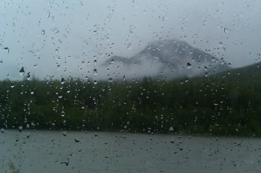 Rain on a window with Alaska view