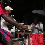 Georgetown Market Woman selling newspapers in Georgetown